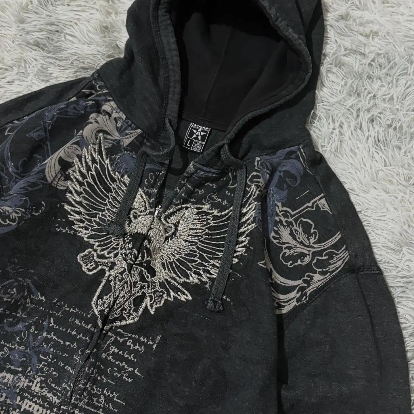 Noxwear Anime Hoodies featuring a black zip-up design with intricate graphic details and Gothic elements.