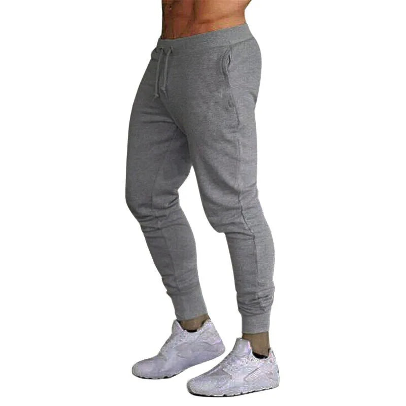Men’s Sports Jogger Pants in gray, featuring an athletic fit and stylish design, perfect for workouts and casual wear.