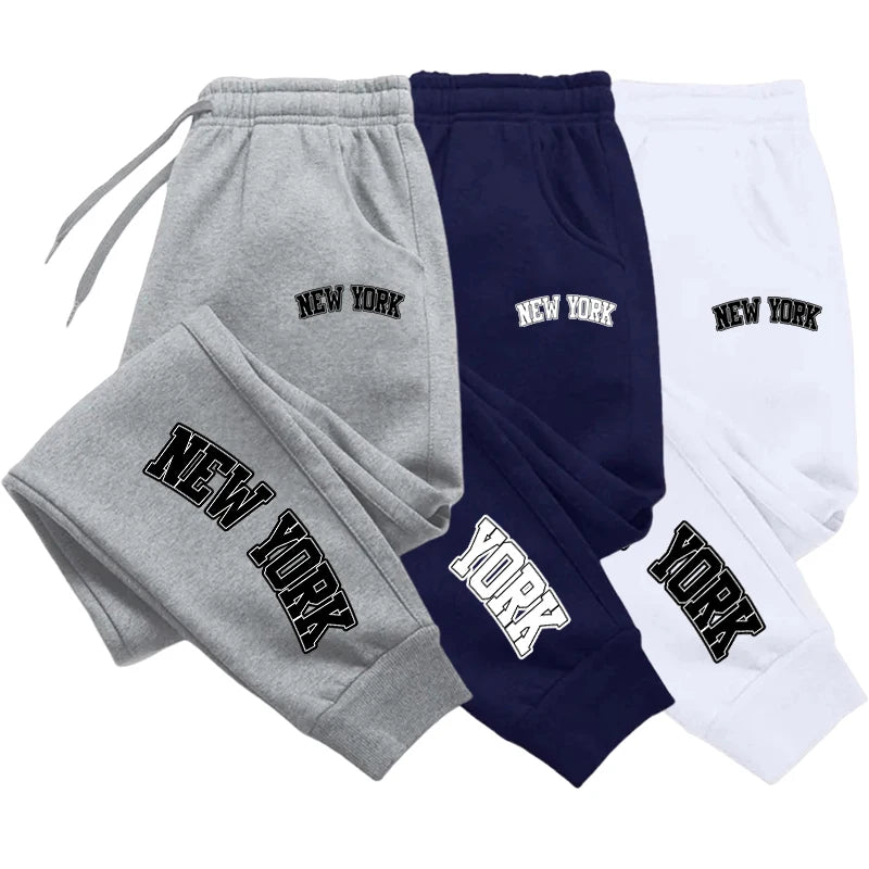 Men’s casual sweatpants in gray with black logo print, featuring drawstring waist for comfort and sporty style.