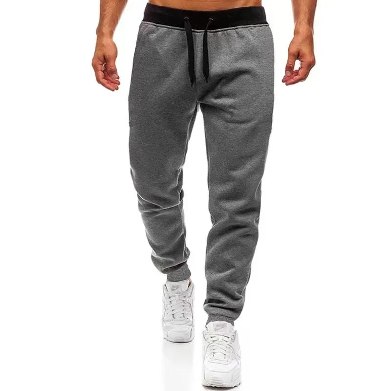 Men’s Sports Jogger Pants in gray with elastic waistband, perfect for workouts and casual wear.