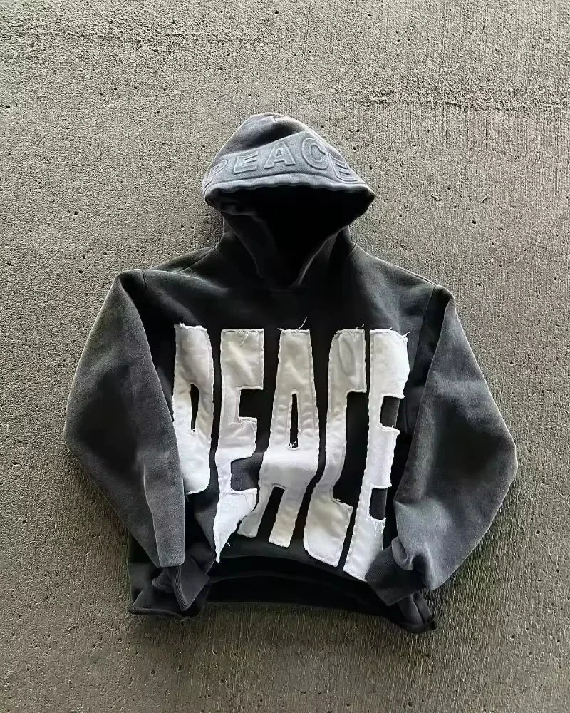Noxwear Anime Hoodies in black featuring bold PEACE chest print, oversized fit, and modern streetwear style.
