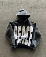 Noxwear Anime Hoodies in black featuring bold PEACE chest print, oversized fit, and modern streetwear style.